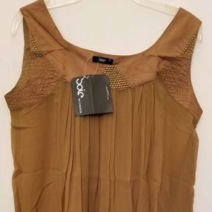 New never worn sleeveless tunic with detail yoke.